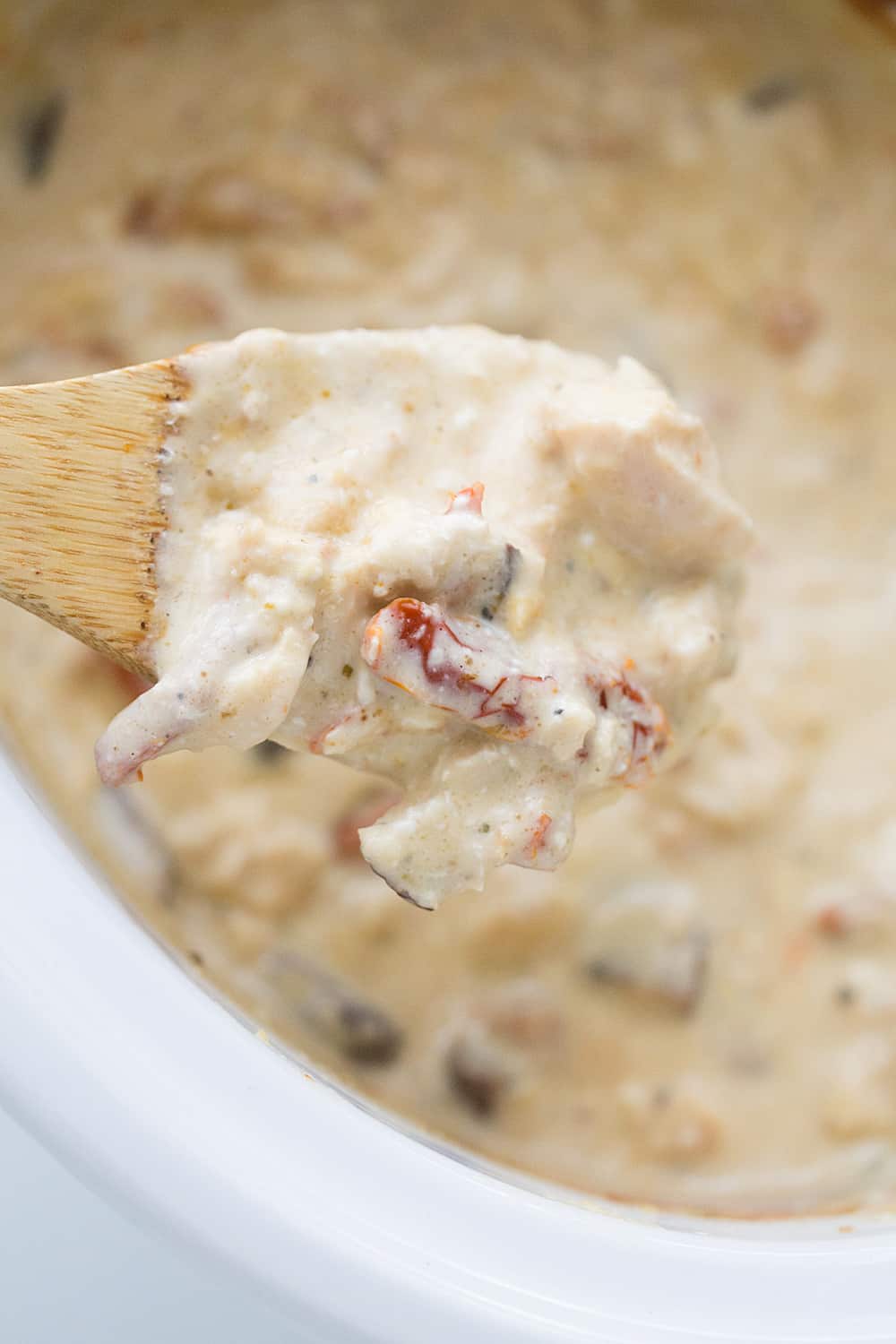 Slow Cooker Creamy Italian Chicken - Slow cooker creamy Italian chicken is easy, creamy, and comforting. You and your family will love this simple weeknight meal! #slowcooker #crockpot #chicken #recipe #chickenrecipe #halfscratched #italianchicken #cooking #easyrecipe