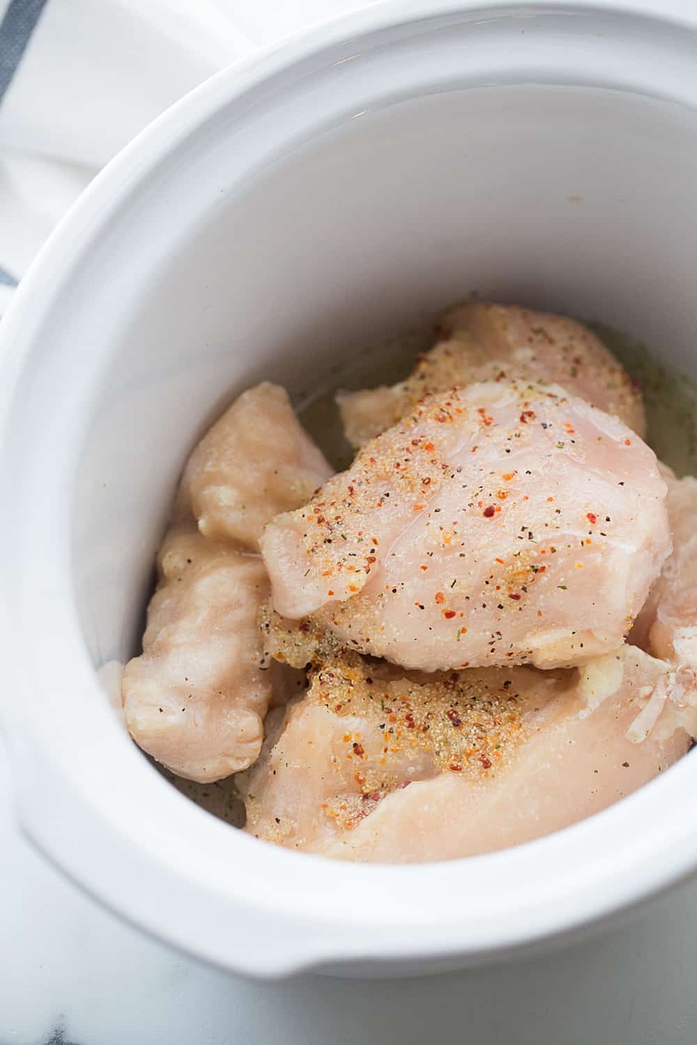 Slow Cooker Creamy Italian Chicken - Slow cooker creamy Italian chicken is easy, creamy, and comforting. You and your family will love this simple weeknight meal! #slowcooker #crockpot #chicken #recipe #chickenrecipe #halfscratched #italianchicken #cooking #easyrecipe