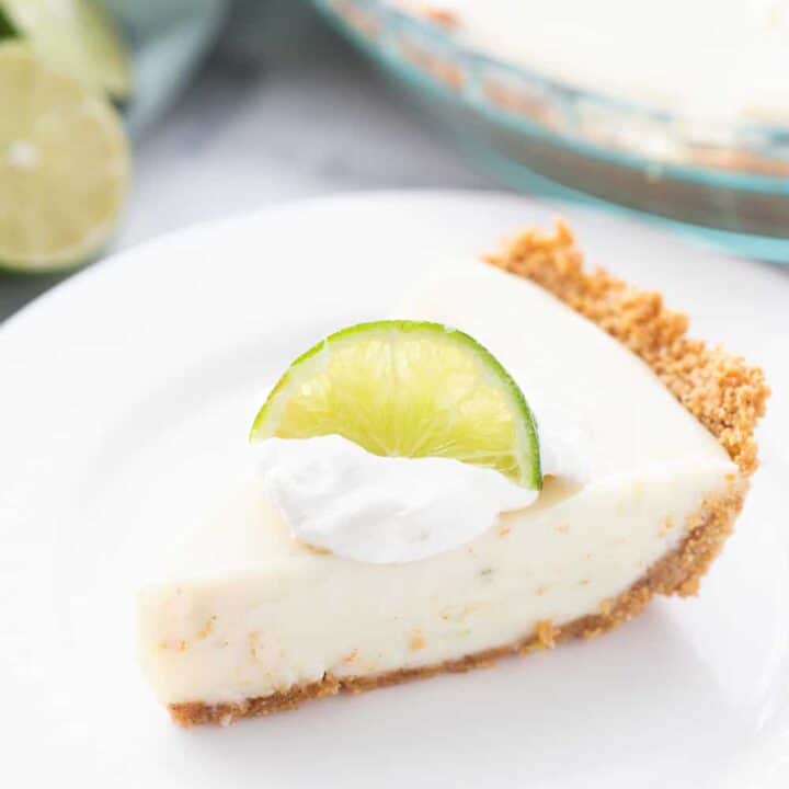 Easy Key Lime Pie with Homemade Whipped Cream - This easy key lime pie calls for a homemade graham cracker crust and the easiest pie filling ever. Top it with homemade whipped cream and it's always a hit! #keylime #keylimepie #whippedcream #dessert #baking #pie #lime #halfscratched