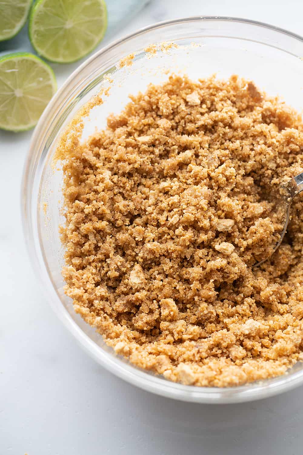 Easy Key Lime Pie with Homemade Whipped Cream - This easy key lime pie calls for a homemade graham cracker crust and the easiest pie filling ever. Top it with homemade whipped cream and it's always a hit! #keylime #keylimepie #whippedcream #dessert #baking #pie #lime #halfscratched