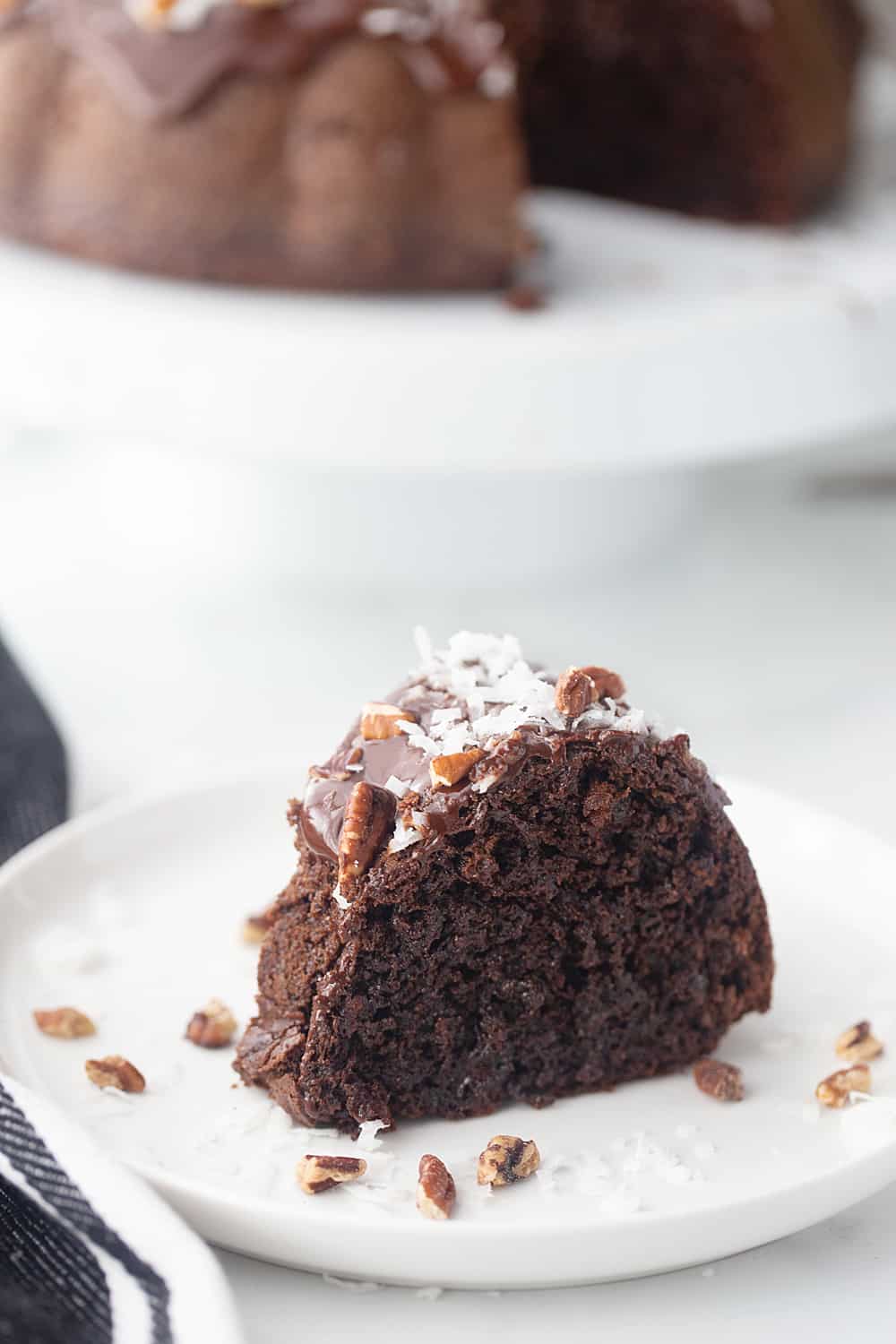 Triple Chocolate Bundt Cake - Try this triple chocolate bundt cake and you'll never bake plain ol' chocolate cake again. Rich, chocolaty, moist, and super easy. #halfscratched #bundt #bundtcake #chocolate #chocolatecake #baking #easydessert #easyrecipe #cake #cakerecipe