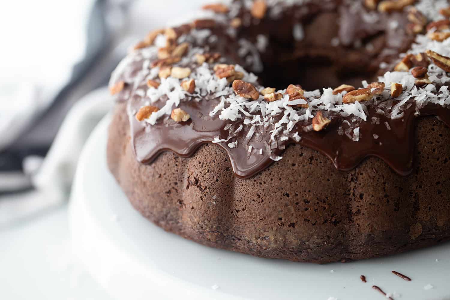 Triple Chocolate Bundt Cake - Try this triple chocolate bundt cake and you'll never bake plain ol' chocolate cake again. Rich, chocolaty, moist, and super easy. #halfscratched #bundt #bundtcake #chocolate #chocolatecake #baking #easydessert #easyrecipe #cake #cakerecipe
