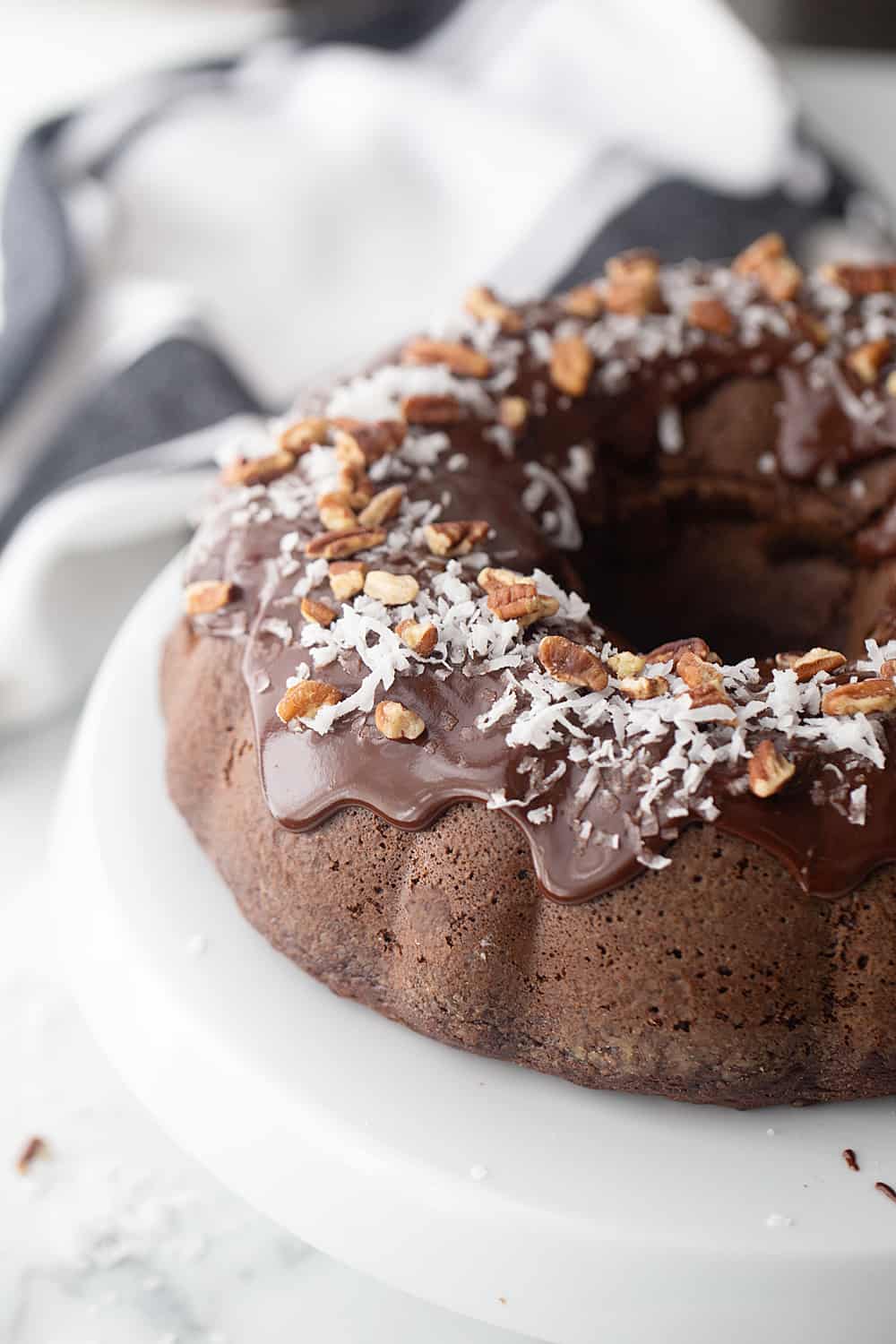 Triple Chocolate Bundt Cake - Try this triple chocolate bundt cake and you'll never bake plain ol' chocolate cake again. Rich, chocolaty, moist, and super easy. #halfscratched #bundt #bundtcake #chocolate #chocolatecake #baking #easydessert #easyrecipe #cake #cakerecipe