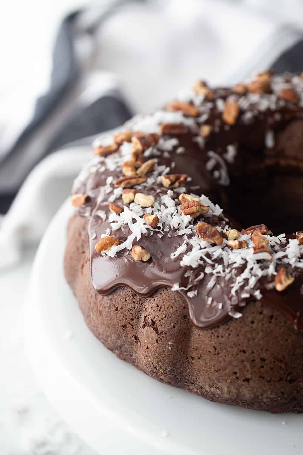 Triple Chocolate Bundt Cake - Try this triple chocolate bundt cake and you'll never bake plain ol' chocolate cake again. Rich, chocolaty, moist, and super easy. #halfscratched #bundt #bundtcake #chocolate #chocolatecake #baking #easydessert #easyrecipe #cake #cakerecipe