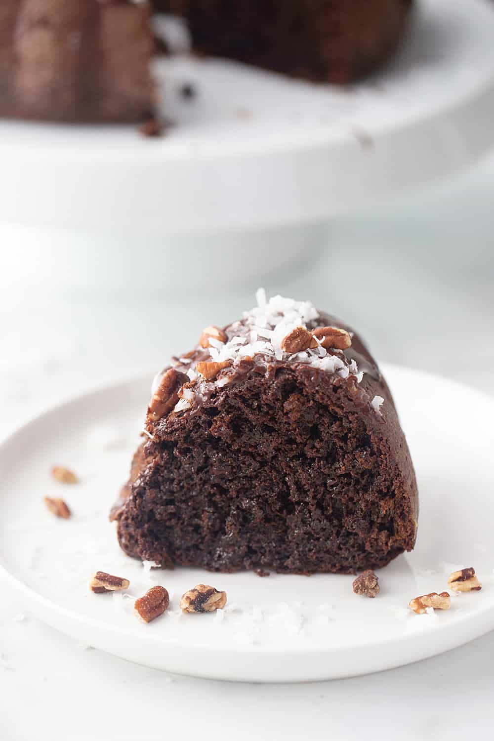 Triple Chocolate Bundt Cake - Try this triple chocolate bundt cake and you'll never bake plain ol' chocolate cake again. Rich, chocolaty, moist, and super easy. #halfscratched #bundt #bundtcake #chocolate #chocolatecake #baking #easydessert #easyrecipe #cake #cakerecipe