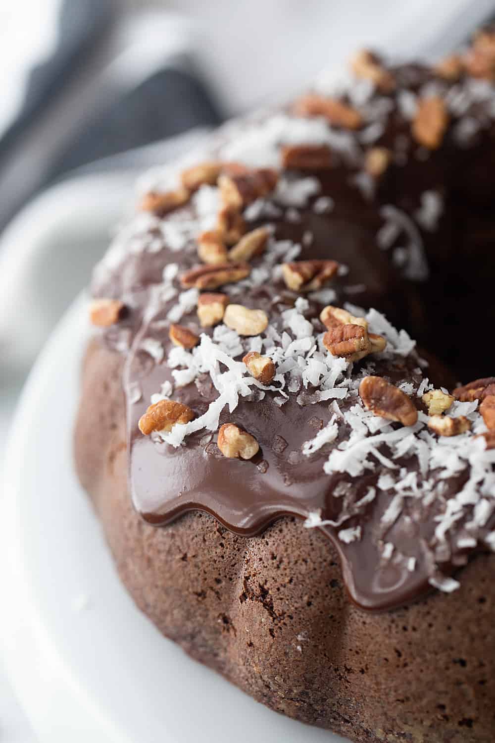 Triple Chocolate Bundt Cake - Try this triple chocolate bundt cake and you'll never bake plain ol' chocolate cake again. Rich, chocolaty, moist, and super easy. #halfscratched #bundt #bundtcake #chocolate #chocolatecake #baking #easydessert #easyrecipe #cake #cakerecipe