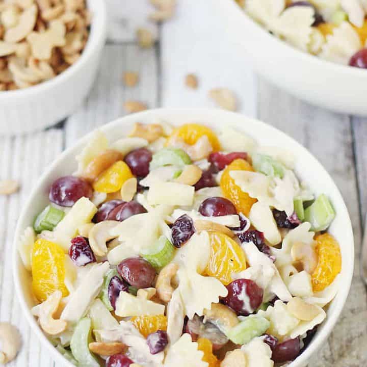 Chicken Bow Tie Pasta Salad -- Chicken bow tie pasta salad is the perfect summer salad! It combines so many delicious ingredients with the crunch of cashews and creamy coleslaw dressing.