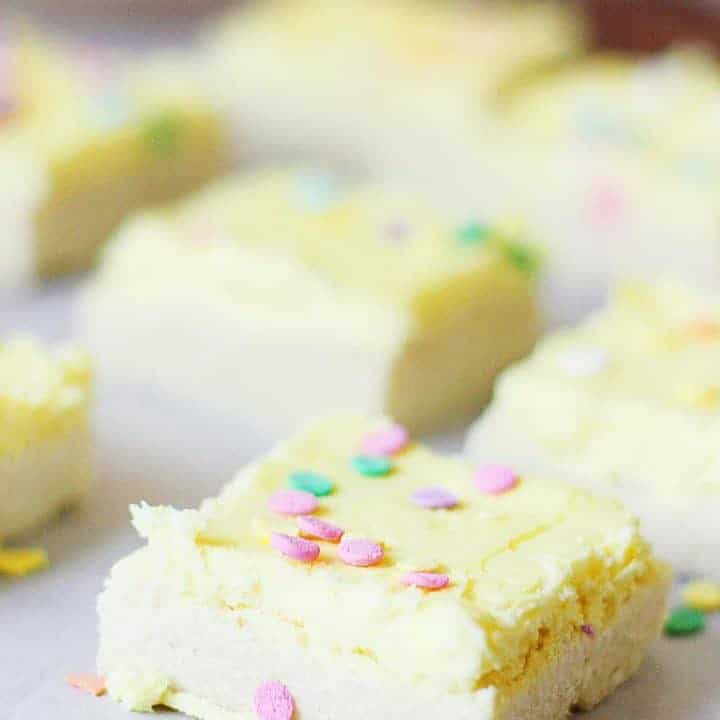 Sugar Cookie Bars - Sugar cookie bars are great for serving a crowd. They're soft and chewy and the frosting is to die for! Plus, they're quicker to make than their individually-portioned sugar cookie counterparts. | halfscratched.com