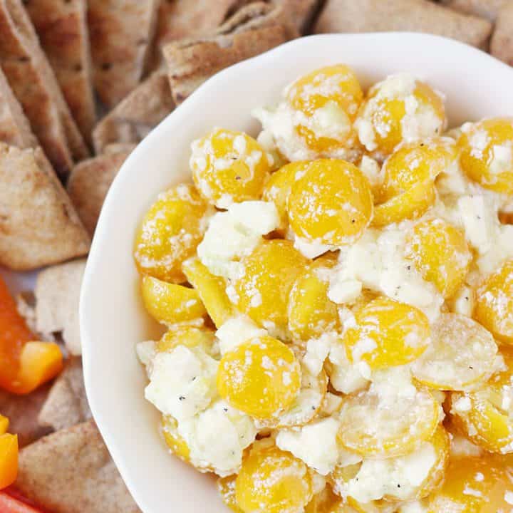 Greek Feta Dip -- Greek feta dip is so easy and addictive you'll want to make it every day. Trust me. The combo of golden tomatoes, feta, and seasonings is irresistible!
