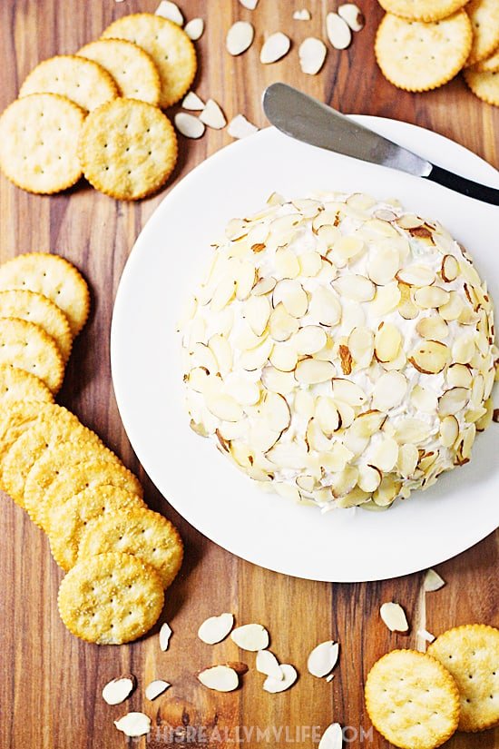 Pineapple Cream Cheese Ball -- This pineapple cream cheese ball features crushed pineapple, cheddar cheese and green onions ... a combination that is crazy delicious! | halfscratched.com