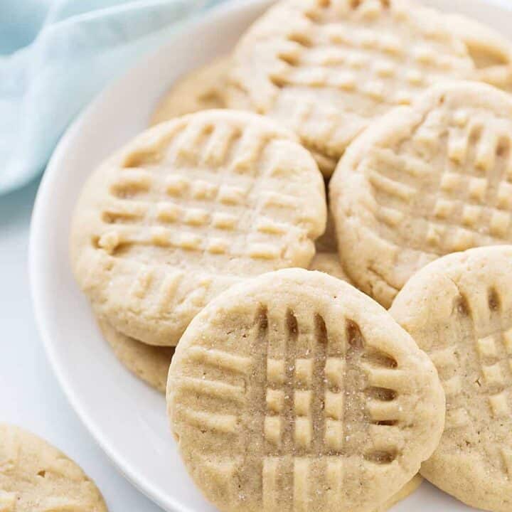 Old-Fashioned Peanut Butter Cookies - Old-fashioned peanut butter cookies are soft, chewy, and oh, so good! Friends and family (and my taste buds) always rave when I bake a batch. #halfscratched #peanutbutter #cookies #cookierecipe #baking #peanutbuttercookies #desserts #sweets #cookies