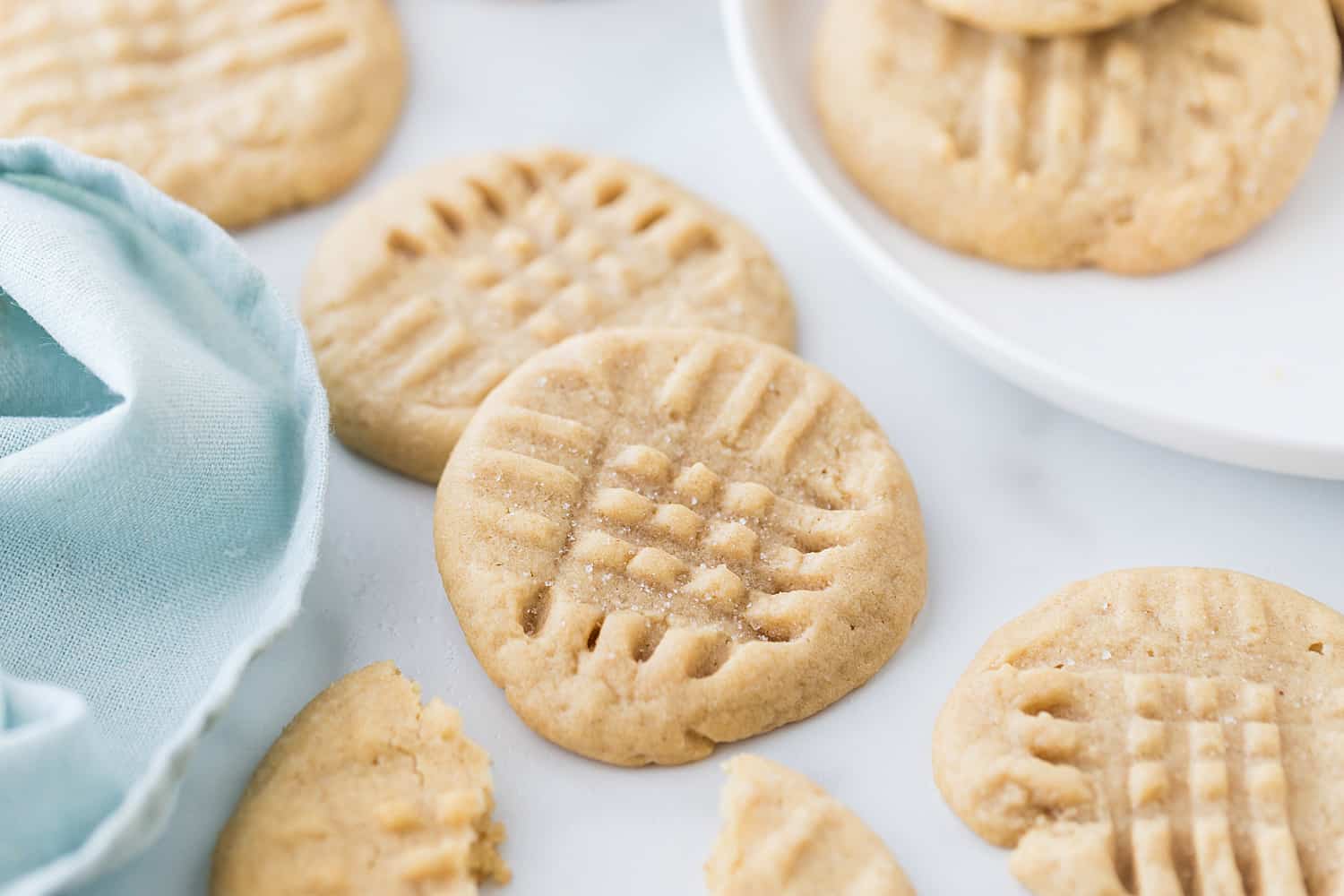 Old-Fashioned Peanut Butter Cookies - Old-fashioned peanut butter cookies are soft, chewy, and oh, so good! Friends and family (and my taste buds) always rave when I bake a batch. #halfscratched #peanutbutter #cookies #cookierecipe #baking #peanutbuttercookies #desserts #sweets #cookies