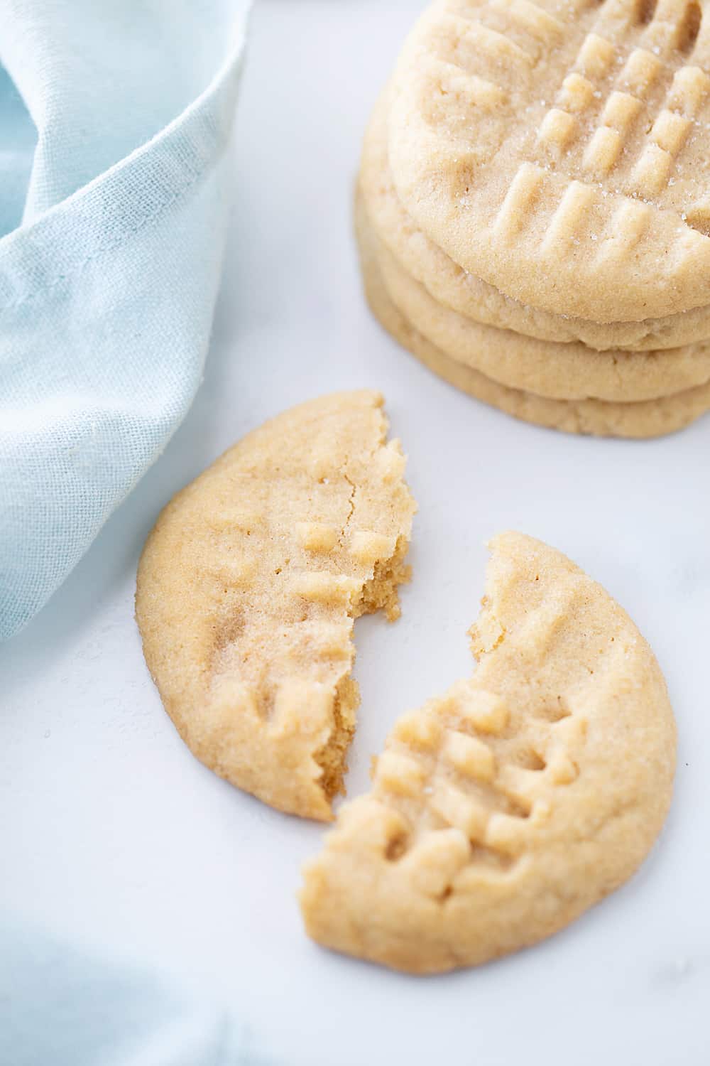 Old-Fashioned Peanut Butter Cookies - Old-fashioned peanut butter cookies are soft, chewy, and oh, so good! Friends and family (and my taste buds) always rave when I bake a batch. #halfscratched #peanutbutter #cookies #cookierecipe #baking #peanutbuttercookies #desserts #sweets #cookies
