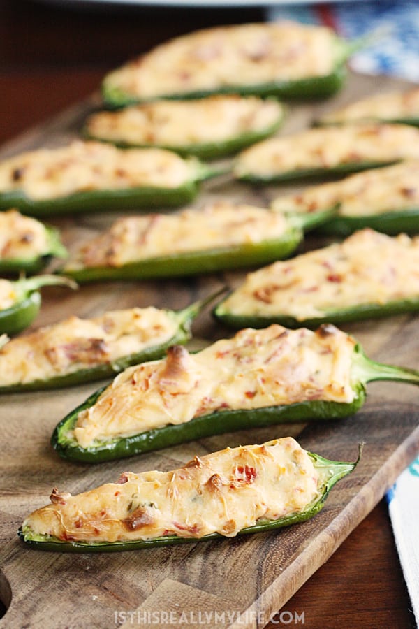 Vegetarian Stuffed Jalapenos with Sun-Dried Tomatoes & Bacon -- These vegetarian stuffed jalapenos with sun-dried tomatoes and bacon are simple, super tasty and a real crowd pleaser. Not vegetarian? Use real bacon instead! | halfscratched.com