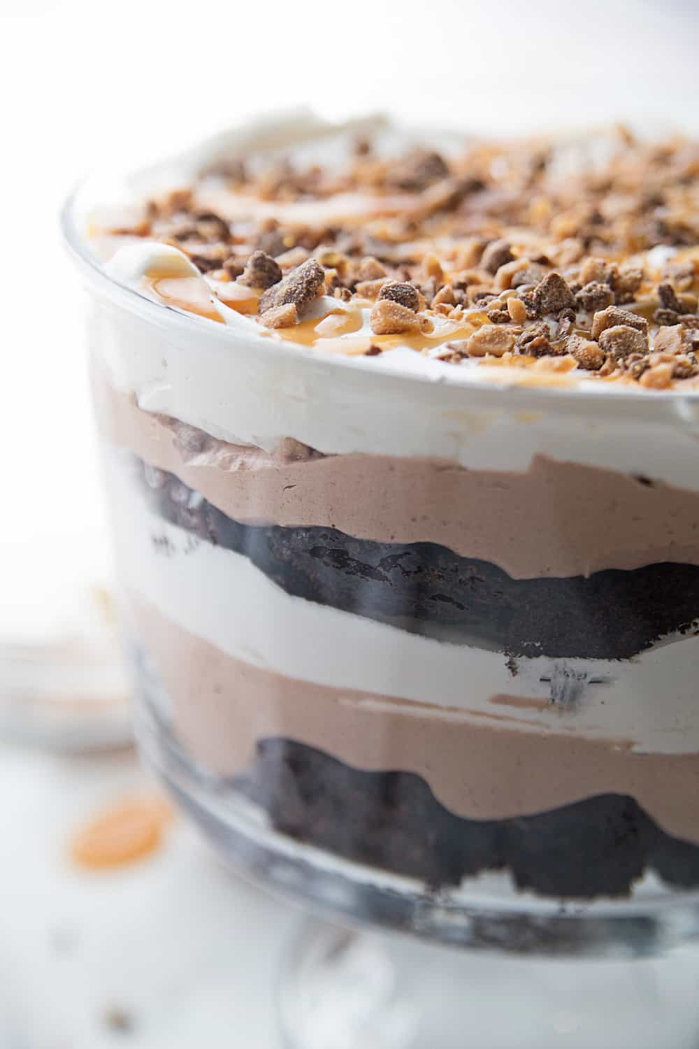 Chocolate Brownie Trifle - Chocolate brownie trifle features layers of rich, chocolate brownies, fudge pudding, whipped topping, toffee, and caramel. What's not to love? #trifle #brownie #dessert #halfscratched #chocolatetrifle #brownietrifle #sweet #baking