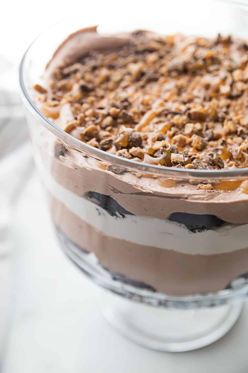 Chocolate Brownie Trifle - Chocolate brownie trifle features layers of rich, chocolate brownies, fudge pudding, whipped topping, toffee, and caramel. What's not to love? #trifle #brownie #dessert #halfscratched #chocolatetrifle #brownietrifle #sweet #baking