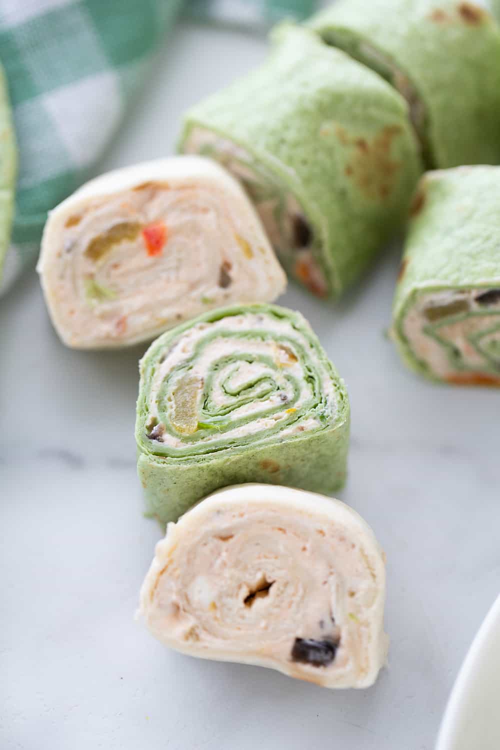 Mexican Pinwheels - Mexican pinwheels are the best appetizer! They're so eays and so flavorful. And even better, you can make them a day ahead! #appetizer #halfscratched #pinwheels #appetizerrecipe #partyfood #easyrecipe #easyappetizer #creamcheese