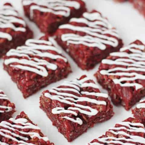 Red Velvet Rice Krispie Treats - slight cocoa flavor with a drizzle of white chocolate. Perfect dessert for Valentines Day (or Christmas)!