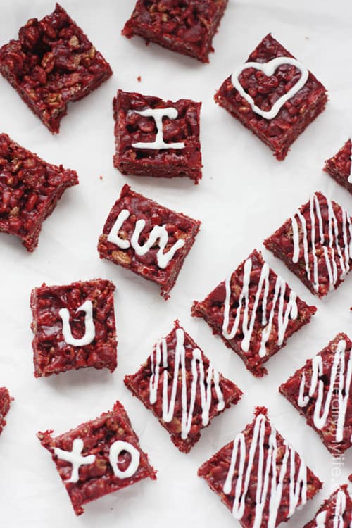 Red Velvet Rice Krispie Treats - slight cocoa flavor with a drizzle of white chocolate. Perfect dessert for Valentines Day (or Christmas)!