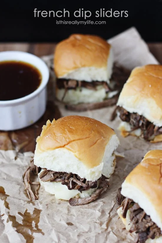 French Dip Sliders - so easy to make using a slow cooker and Hawaiian rolls. So fun to eat thanks to the smaller size!