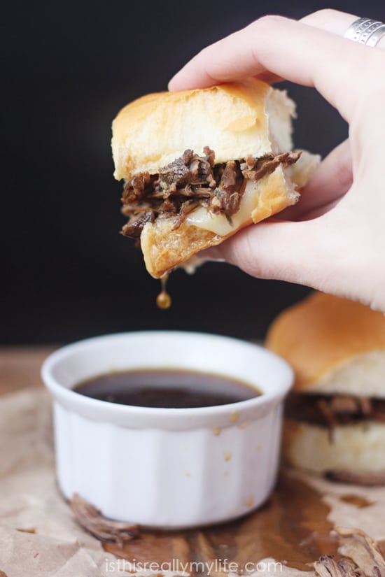 French Dip Sliders - so easy to make using a slow cooker and Hawaiian rolls. So fun to eat thanks to the smaller size!
