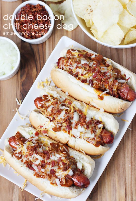 Double Bacon Chili Cheese Dog - hot dogs wrapped with bacon, grilled and topped with chili, cheese, onion and more bacon! Recipe from halfscratched.com