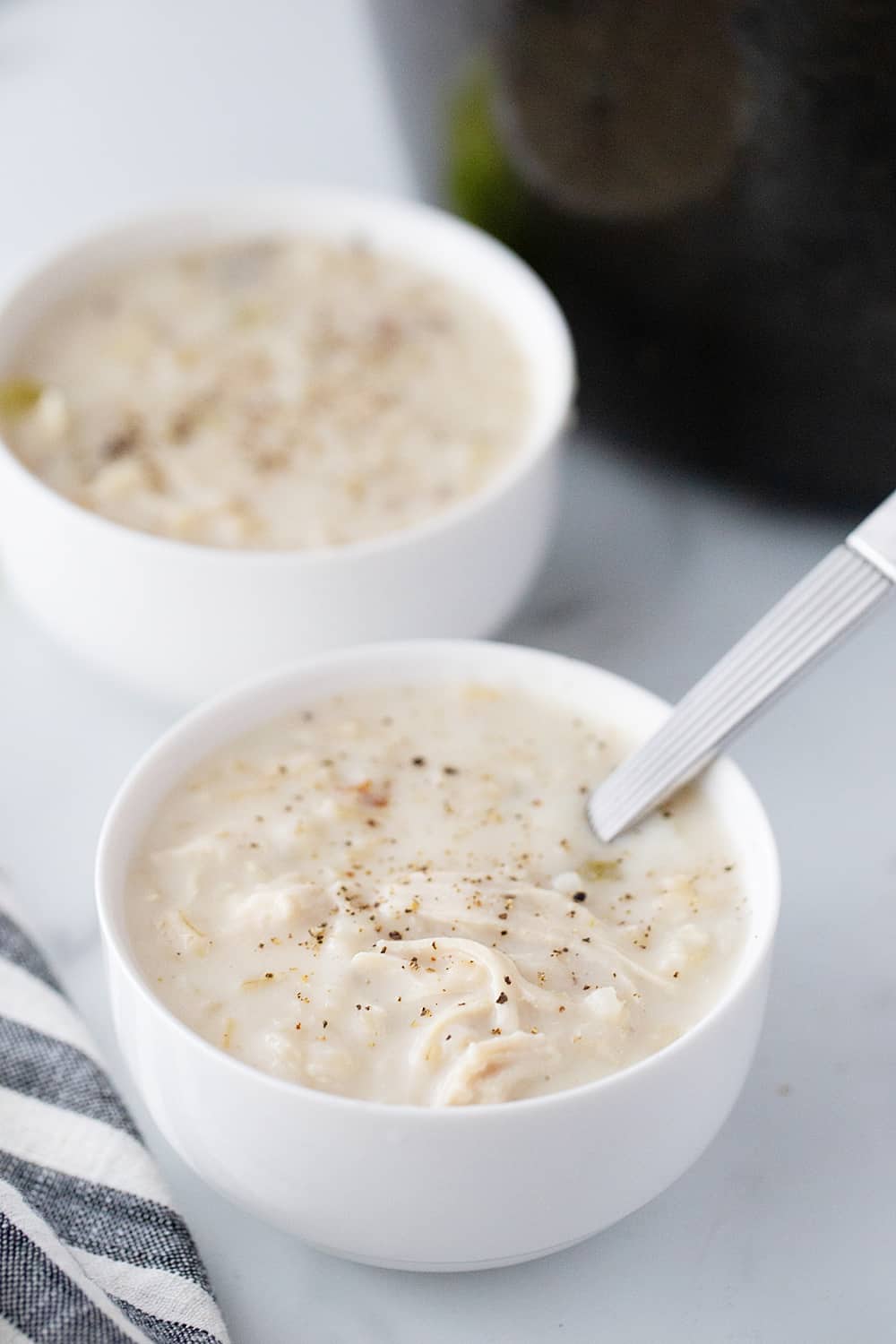 Creamy Chicken and Rice Soup - Creamy chicken and rice soup is a hearty meal with simple ingredients like brown rice, celery, onion, and chicken. Total family favorite! #halfscratched #soup #souprecipe #chickensoup #ricesoup #easyrecipe #maindish