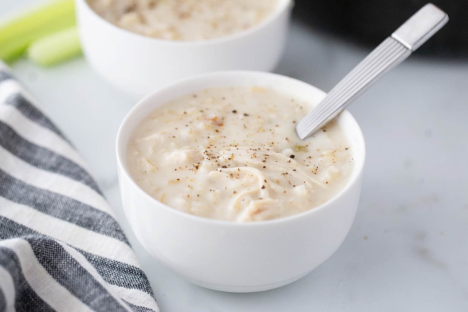 Creamy Chicken and Rice Soup - Creamy chicken and rice soup is a hearty meal with simple ingredients like brown rice, celery, onion, and chicken. Total family favorite!