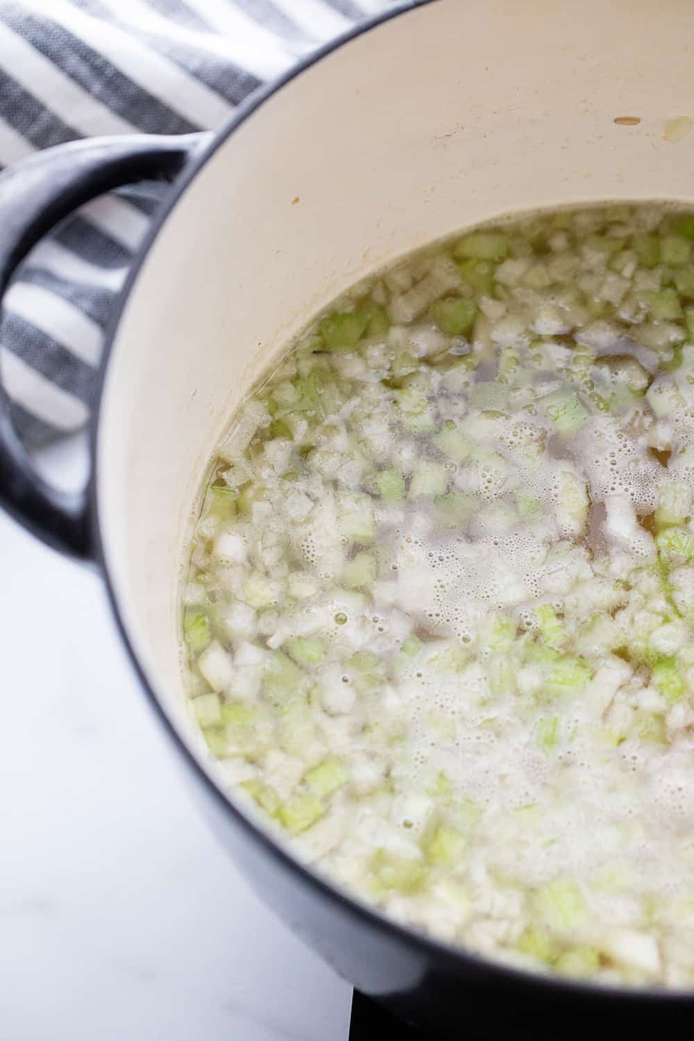 Creamy Chicken and Rice Soup - Creamy chicken and rice soup is a hearty meal with simple ingredients like brown rice, celery, onion, and chicken. Total family favorite!