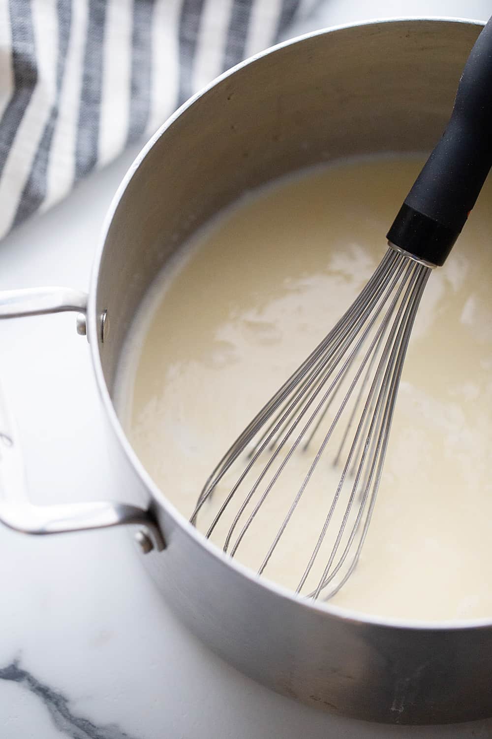 Creamy Chicken and Rice Soup - Creamy chicken and rice soup is a hearty meal with simple ingredients like brown rice, celery, onion, and chicken. Total family favorite!