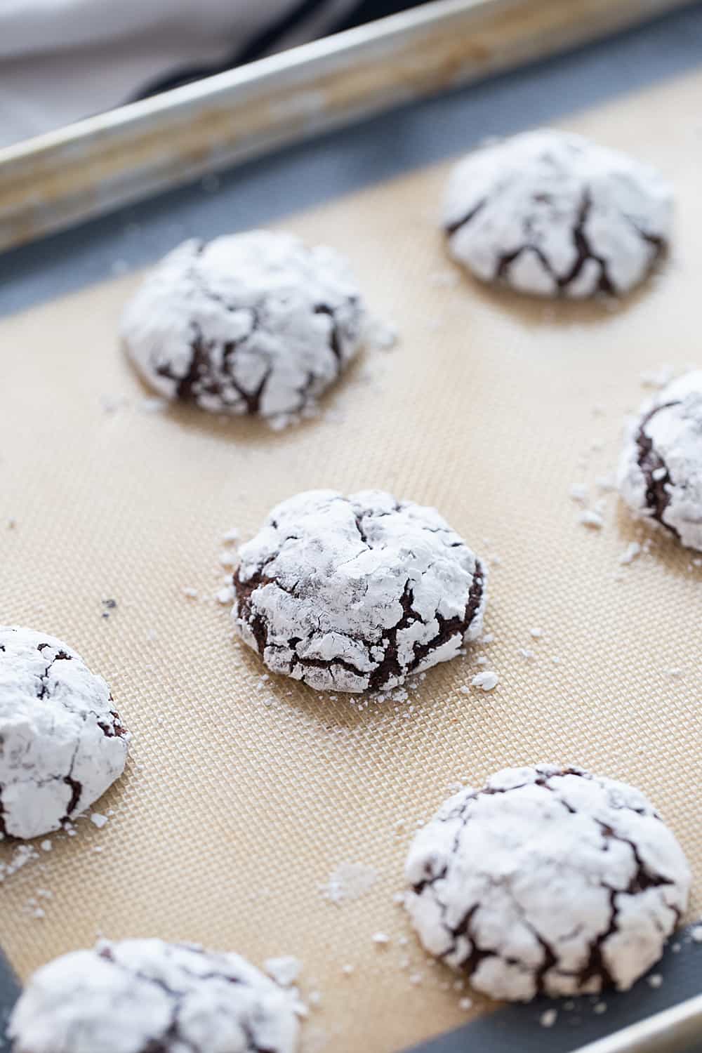 Double Chocolate Crinkle Cookies - Instant espresso powder + mini semisweet chocolate chips = next-level double chocolate crinkle cookies. One bite and you'll be hooked! #halfscratched #chocolate #cookies #crinklecookies #baking #cookierecipe #holidayrecipe #easyrecipe 