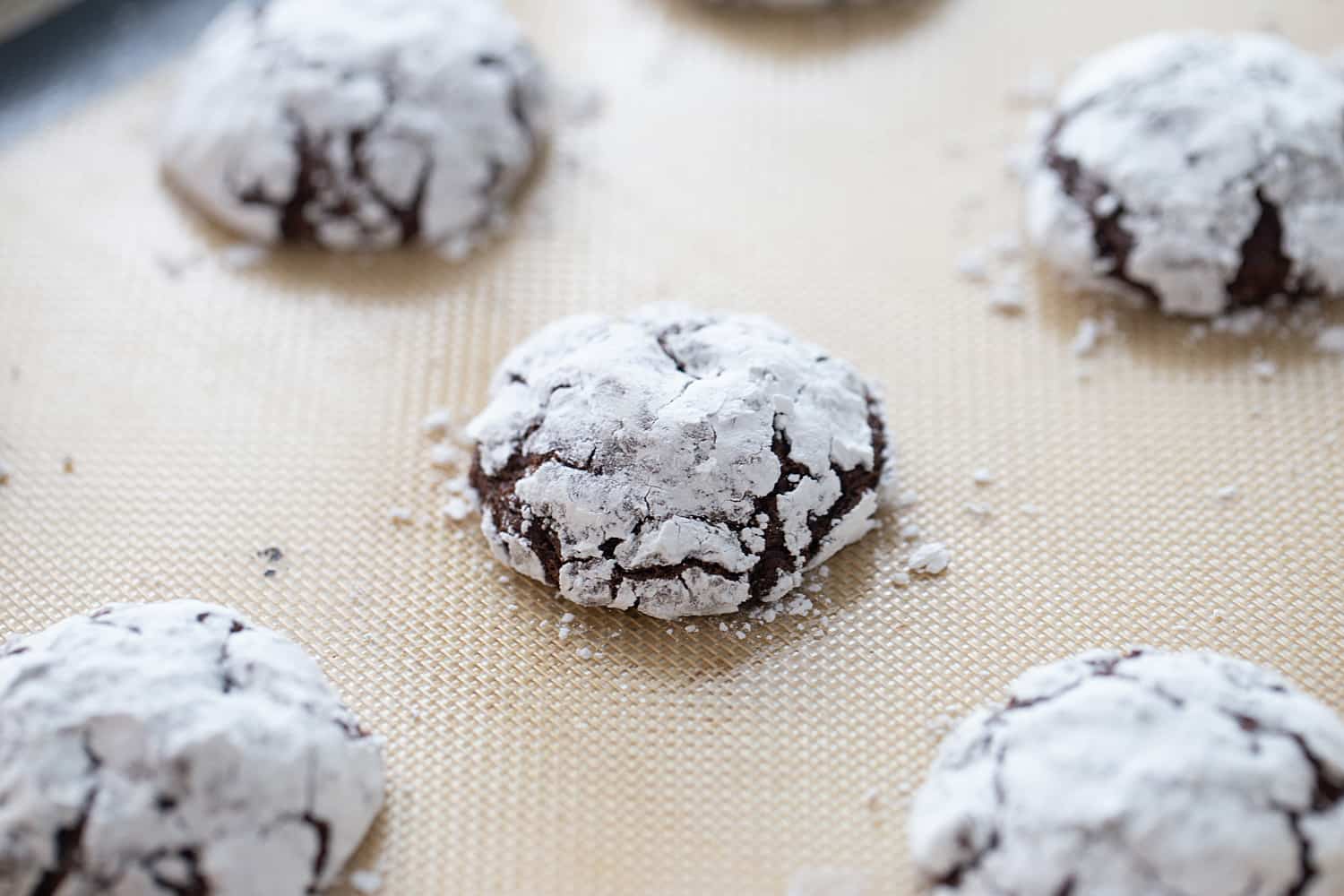 Double Chocolate Crinkle Cookies - Instant espresso powder + mini semisweet chocolate chips = next-level double chocolate crinkle cookies. One bite and you'll be hooked! #halfscratched #chocolate #cookies #crinklecookies #baking #cookierecipe #holidayrecipe #easyrecipe 