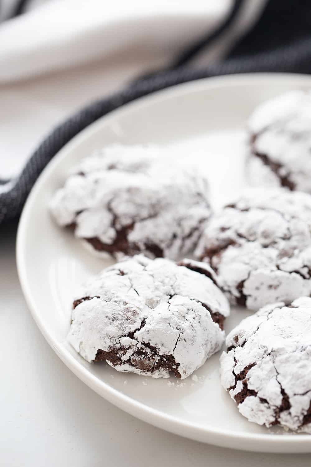 Double Chocolate Crinkle Cookies - Instant espresso powder + mini semisweet chocolate chips = next-level double chocolate crinkle cookies. One bite and you'll be hooked! #halfscratched #chocolate #cookies #crinklecookies #baking #cookierecipe #holidayrecipe #easyrecipe 