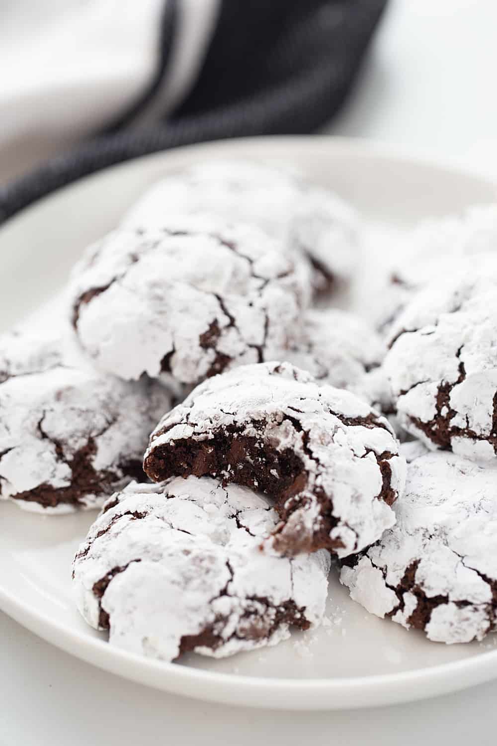 Double Chocolate Crinkle Cookies - Instant espresso powder + mini semisweet chocolate chips = next-level double chocolate crinkle cookies. One bite and you'll be hooked! #halfscratched #chocolate #cookies #crinklecookies #baking #cookierecipe #holidayrecipe #easyrecipe 