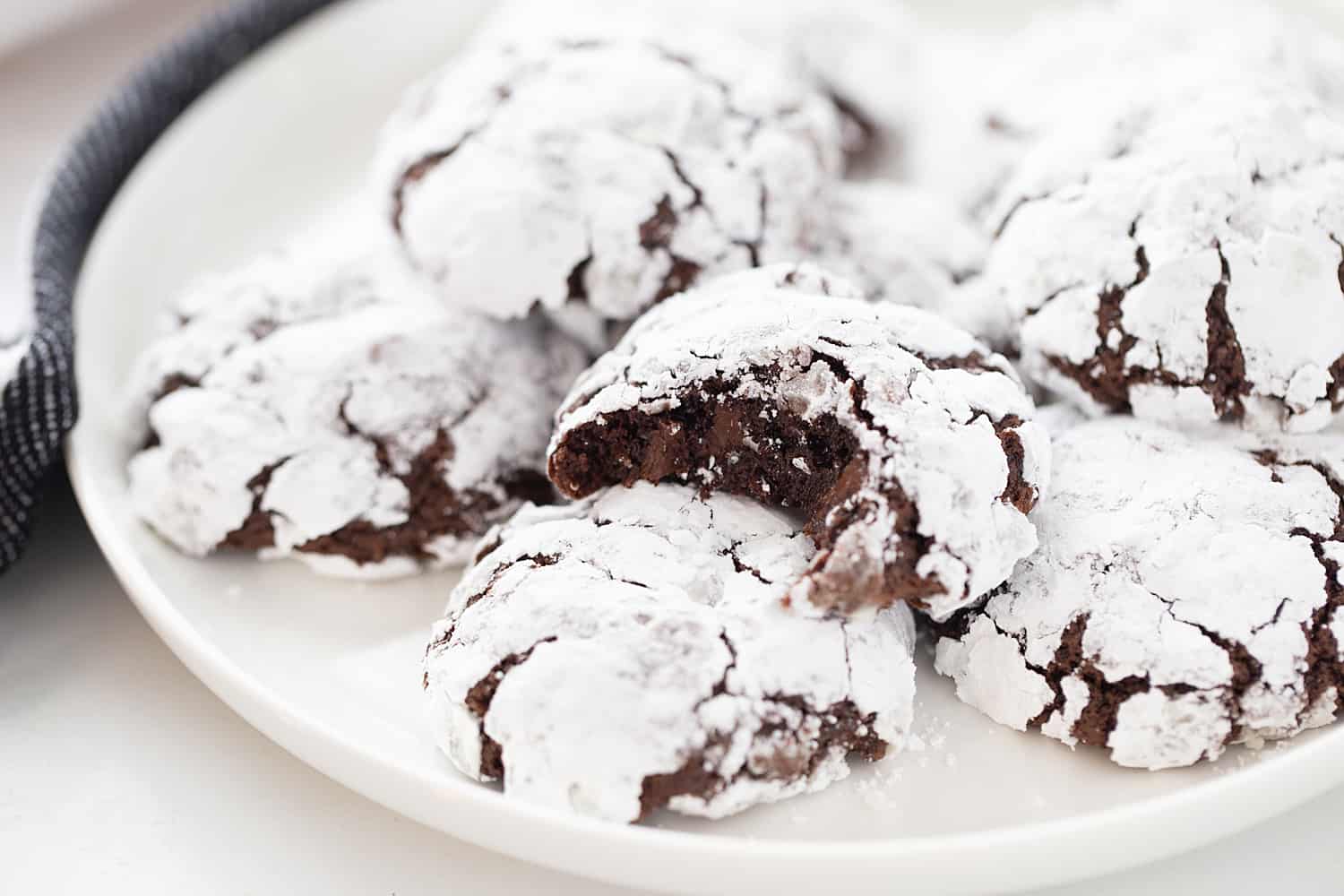 Double Chocolate Crinkle Cookies - Instant espresso powder + mini semisweet chocolate chips = next-level double chocolate crinkle cookies. One bite and you'll be hooked! #halfscratched #chocolate #cookies #crinklecookies #baking #cookierecipe #holidayrecipe #easyrecipe 