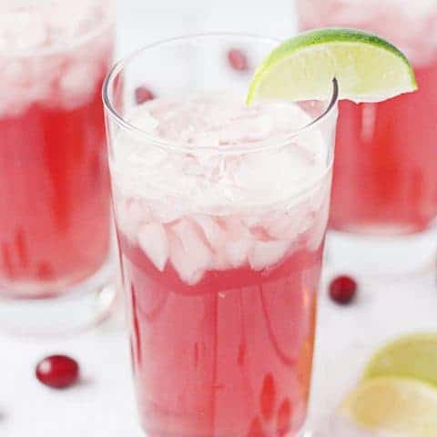 Very Berry Mocktail Recipe -- This non-alcoholic cocktail is full of berry flavor thanks to cranberry juice, pink lemonade and Dasani sparkling water in Berry flavor. Great for kids of all ages! | halfscratched.com #SparklingHolidays #ad #mocktail #berry #cocktail #holidayrecipe #holidays #mocktailrecipe #dasani #halfscratched