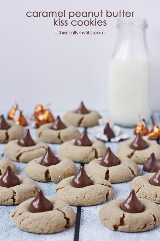 Caramel Peanut Butter Kiss Cookies -- THE BEST peanut butter blossom cookies you will ever eat, hands down. Gooey caramel and chocolate combined with a soft, chewy peanut butter cookie. Enough said.