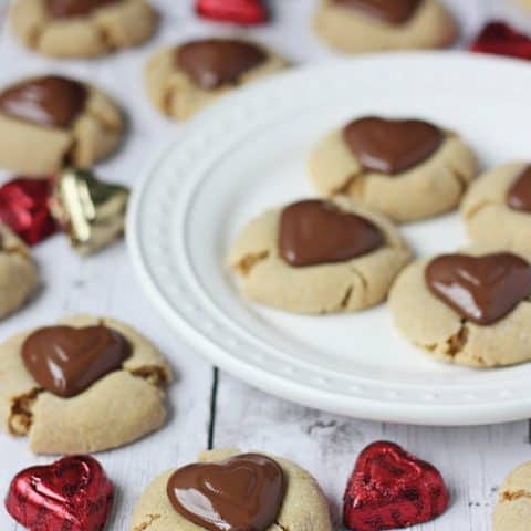Double Peanut Butter Blossom Cookies -- you can totally wait for these to est before eating but I prefer indulging while still warm. These cookies melt in your mouth and may change your life. Or your Valentines Day.