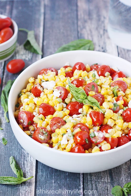 Corn salad with tomato, basil and feta