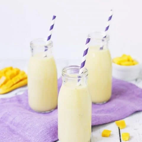 Pineapple Coconut Mango Smoothie -- This smoothie has only five ingredients and is packed with antioxidants and vitamins. It features fresh or frozen mango, frozen pineapple, Greek yogurt, coconut milk and banana. So yummy and great for workouts!