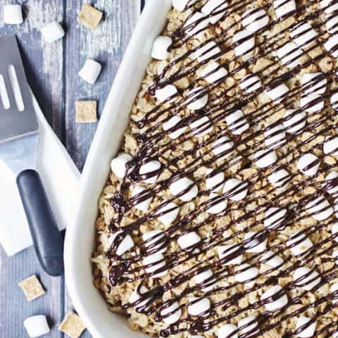 Smores Rice Krispie Treats -- Classic rice krispie treats are topped with marshmallows, crushed Golden Grahams and a drizzle of semisweet chocolate.