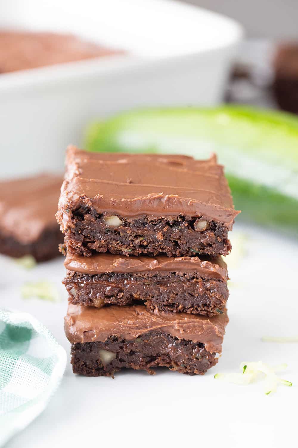 Frosted Zucchini Brownies - Frosted zucchini brownies feature a decadent chocolate flavor and rich, creamy frosting. And guess what? You can't taste zucchini in this brownie recipe! #halfscratched #brownies #brownie #recipe #baking #chocolate #zucchini #dessert #sweets