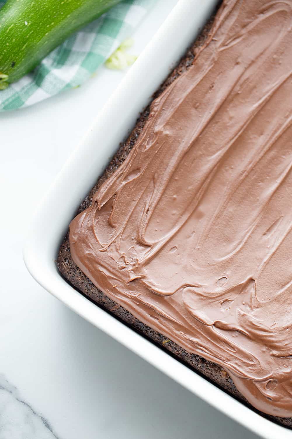 Frosted Zucchini Brownies - Frosted zucchini brownies feature a decadent chocolate flavor and rich, creamy frosting. And guess what? You can't taste zucchini in this brownie recipe! #halfscratched #brownies #brownie #recipe #baking #chocolate #zucchini #dessert #sweets