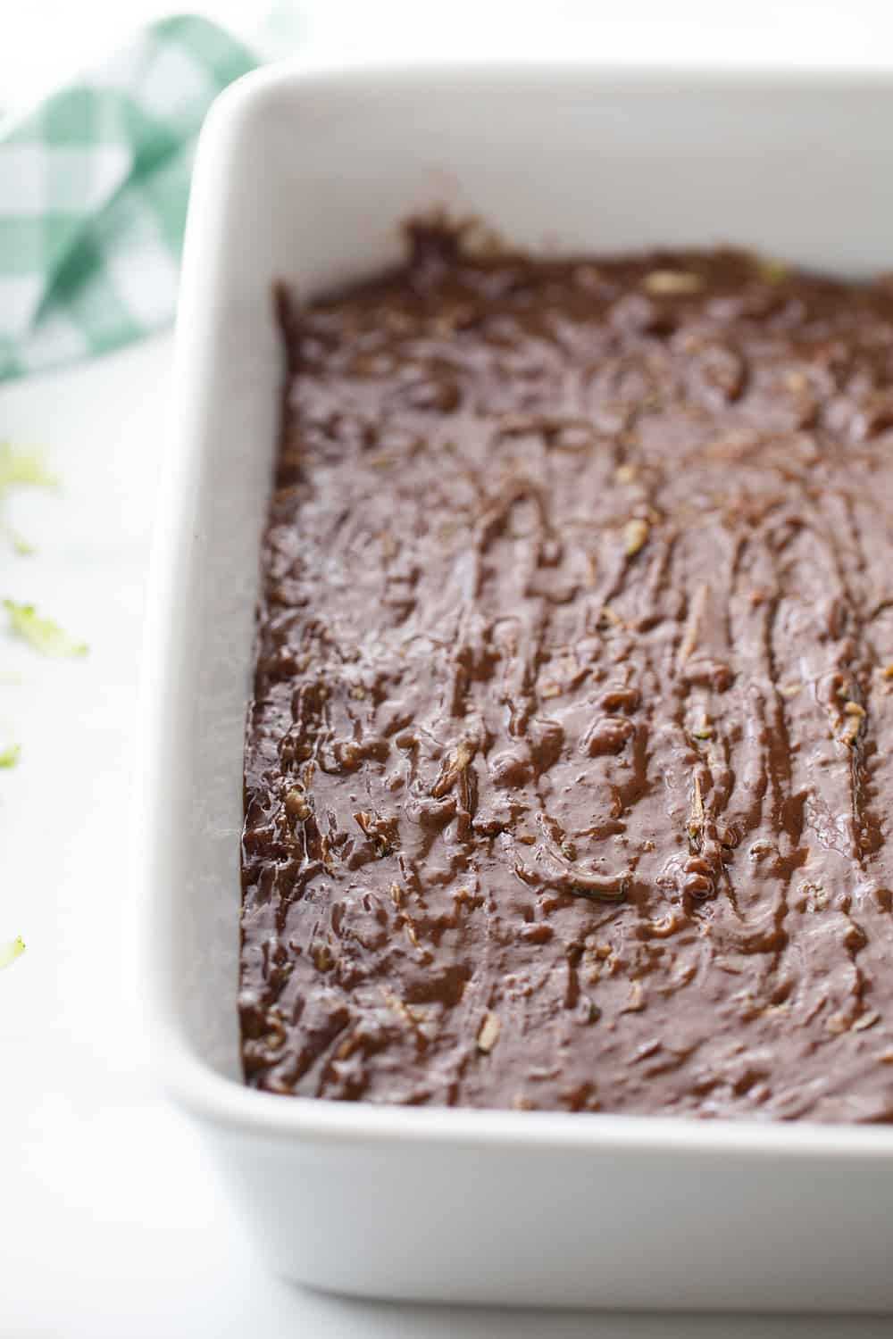 Frosted Zucchini Brownies - Frosted zucchini brownies feature a decadent chocolate flavor and rich, creamy frosting. And guess what? You can't taste zucchini in this brownie recipe! #halfscratched #brownies #brownie #recipe #baking #chocolate #zucchini #dessert #sweets