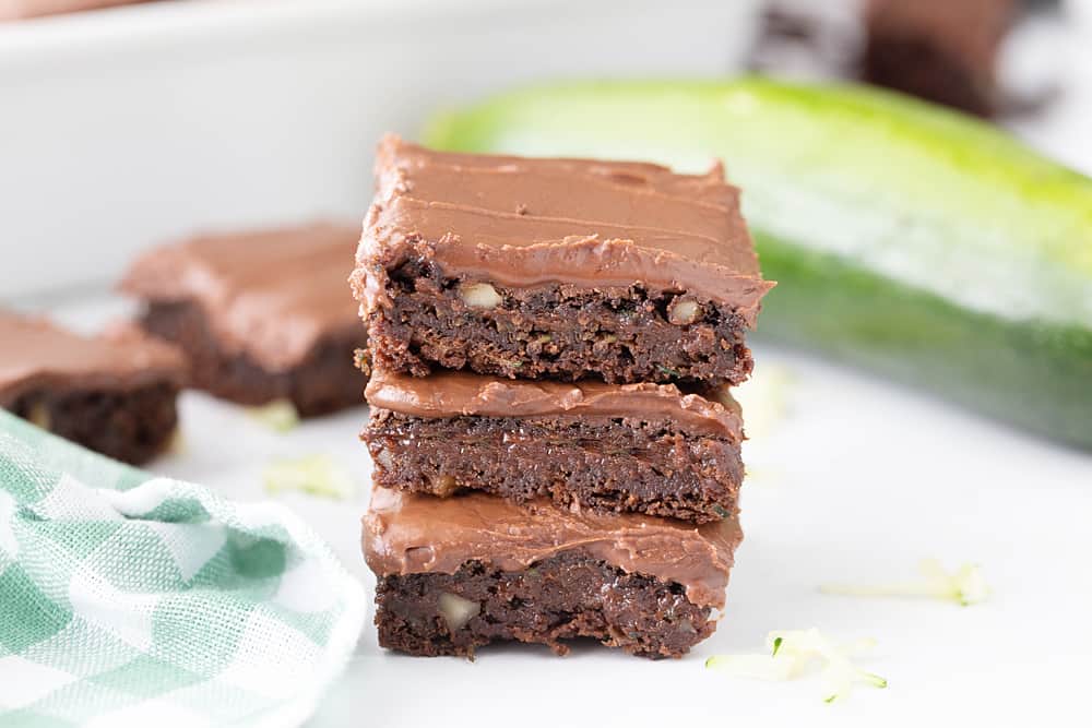 Frosted Zucchini Brownies - Frosted zucchini brownies feature a decadent chocolate flavor and rich, creamy frosting. And guess what? You can't taste zucchini in this brownie recipe! #halfscratched #brownies #brownie #recipe #baking #chocolate #zucchini #dessert #sweets