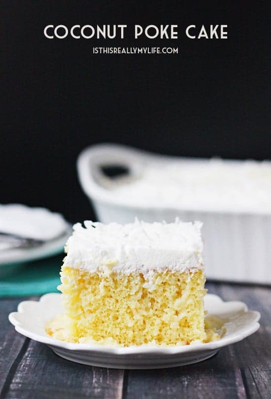 Coconut Poke Cake -- This coconut poke cake features a yellow cake infused with sweet coconut cream and topped with homemade whipped cream frosting and shredded coconut.