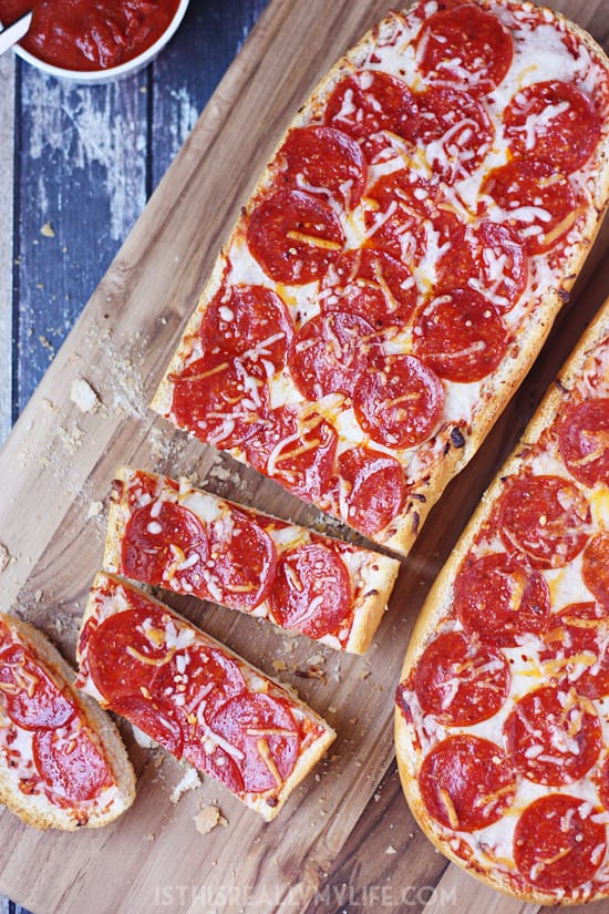 Easy French Bread Pizza - French bread pizza is a super quick and easy way to make homemade pizza. Let the kids make their own for a fun family meal!