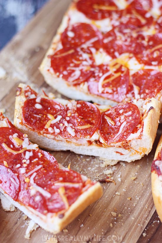 Easy French Bread Pizza - French bread pizza is a super quick and easy way to make homemade pizza. Let the kids make their own for a fun family meal!