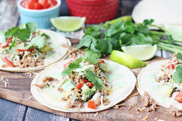Pressure Cooker Cafe Rio Pork Tacos -- I took our favorite slow cooker Cafe Rio pork and converted it into an equally scrumptious pressure cooker Cafe Rio pork. Do not forget the creamy cilantro dressing! | halfscratched.com