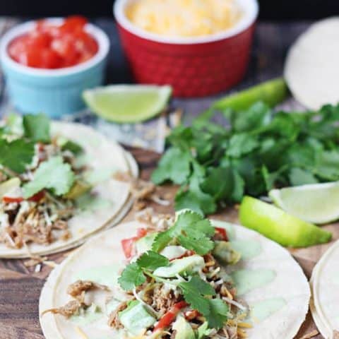 Pressure Cooker Cafe Rio Pork Tacos -- I took our favorite slow cooker Cafe Rio pork and converted it into an equally scrumptious pressure cooker Cafe Rio pork. Do not forget the creamy cilantro dressing! | halfscratched.com